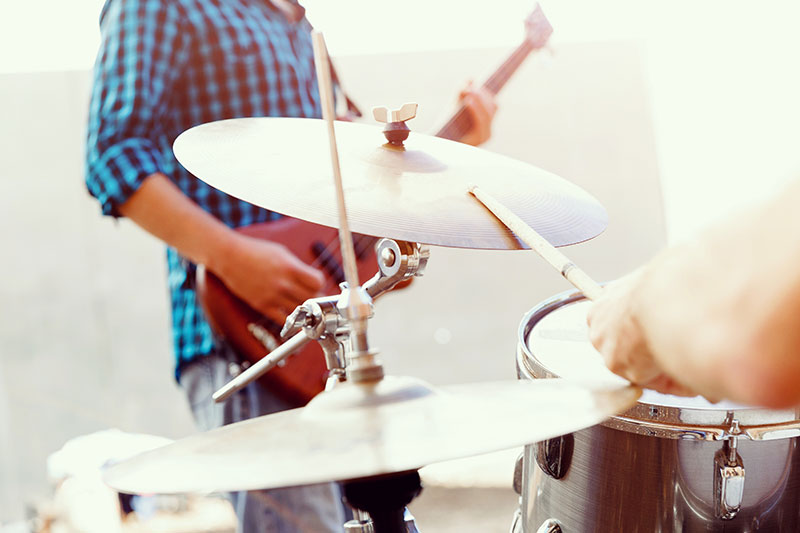 man playing drums at an event